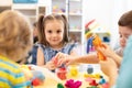 Group of kids play with modeling clay Royalty Free Stock Photo