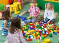 Group of kids playing with colorful constructor