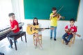 Group of kids playing Music Instruments and smile Royalty Free Stock Photo