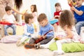 Group of kids playing musical toys. Early musical education in kindergarten Royalty Free Stock Photo