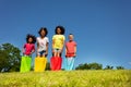 Group of kids race in sacks downhill on the lawn Royalty Free Stock Photo