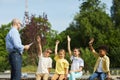 Group of Kids Raising Hands in Outdoor Lesson Royalty Free Stock Photo