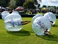 Fun: kids rolling in bump balls zorbing Royalty Free Stock Photo