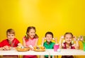 Group of kids sit at the table with Easter eggs Royalty Free Stock Photo