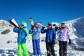 Group of kids with ski on shoulder in the mountain Royalty Free Stock Photo