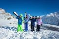 Group of kids with ski on shoulder in the snow Royalty Free Stock Photo