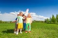 Group of kids stand in circle with carton rocket Royalty Free Stock Photo