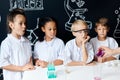 Group of kids and teachers carrying out a science experiment