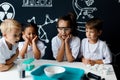Group of kids and teachers carrying out a science experiment Royalty Free Stock Photo