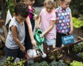 Group of kids watering the plants
