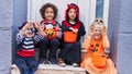 Group of kids wearing halloween costume doing fear gesture at street Royalty Free Stock Photo