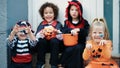 Group of kids wearing halloween costume doing fear gesture at street Royalty Free Stock Photo