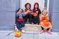 Group of kids wearing halloween costume doing fear gesture at street Royalty Free Stock Photo