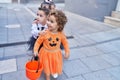 Group of kids wearing halloween costume walking together at street Royalty Free Stock Photo