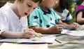 Group of kindergarten kids friends drawing art class outdoors Royalty Free Stock Photo