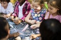 Group of kindergarten kids friends drawing art class outdoors Royalty Free Stock Photo