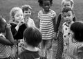 Group of kindergarten kids friends holding hands playing at park Royalty Free Stock Photo