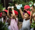 Group of kindergarten kids learning gardening outdoors Royalty Free Stock Photo