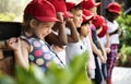 Group of kindergarten kids learning gardening outdoors field trips