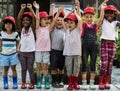 Group of kindergarten kids little farmers learning gardening Royalty Free Stock Photo