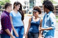 Group of latin and african american young adults talking and hanging out Royalty Free Stock Photo