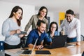 Group of latin business people working together as a teamwork while sitting at the office desk in a creative office in Mexico city Royalty Free Stock Photo