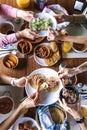 Group of latin Friends eating Mexican Tacos and traditional food, snacks and peoples hands over table, top view. Mexican cuisine L