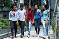 Group of latin and hispanic and african american hipster young adults in city Royalty Free Stock Photo