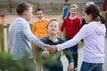 Group of laughing children playing red rover Royalty Free Stock Photo