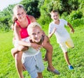 Laughing kids running on grass Royalty Free Stock Photo