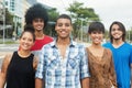 Group of laughing urban young adult people in the city