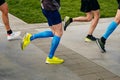 group legs athlete runner running marathon distance race