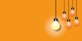 Group light bulb on orange background. Ideas inspiration concepts.