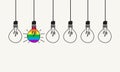 Group of light bulbs, one of them with the pride flag. Equality in business, Creative ideas for innovation, knowledgeable leader. Royalty Free Stock Photo