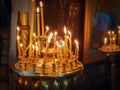 Group of lighted candles glowing in Saint Volodymyr`s Cathedral in Kiev