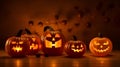 A group of lighted pumpkins with faces on them Royalty Free Stock Photo