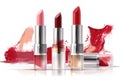 a group of lipsticks with a splash of red paint on the background of the image and a white background with a white background