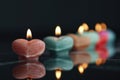 Group of lit candles on a table, suitable for various occasions Royalty Free Stock Photo