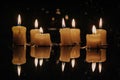 Group of lit candles on a table, suitable for various occasions Royalty Free Stock Photo