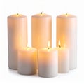 Group of Lit White Wax Candles with Orange Flames on White Background Royalty Free Stock Photo
