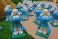 Group of little blue smurfs staring and looking
