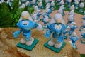 Group of little blue smurfs welcoming and accepting on rocky surface Royalty Free Stock Photo