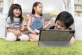 Group of little children diversity watching film together on laptop. Kids playing with laptop computer at home.