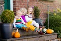 Kids at house porch on autumn day Royalty Free Stock Photo