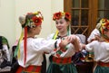 Group of little girls dancers in a native Ukrainian costumes preparing for the performance in a lobby