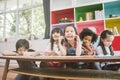 Group of little preschool kids drawing paper with color pencils . portrait of children friends education concept. Royalty Free Stock Photo