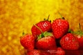 Group of little strawberry soft focus with romantic golden glitter bokeh background.