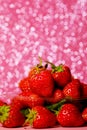 Group of little strawberry soft focus with romantic pink glitter bokeh background.