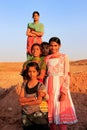 Group of local kids playing near water reservoir, Khichan village, India