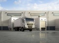 Group of logistic trailer trucks or lorries at warehouse